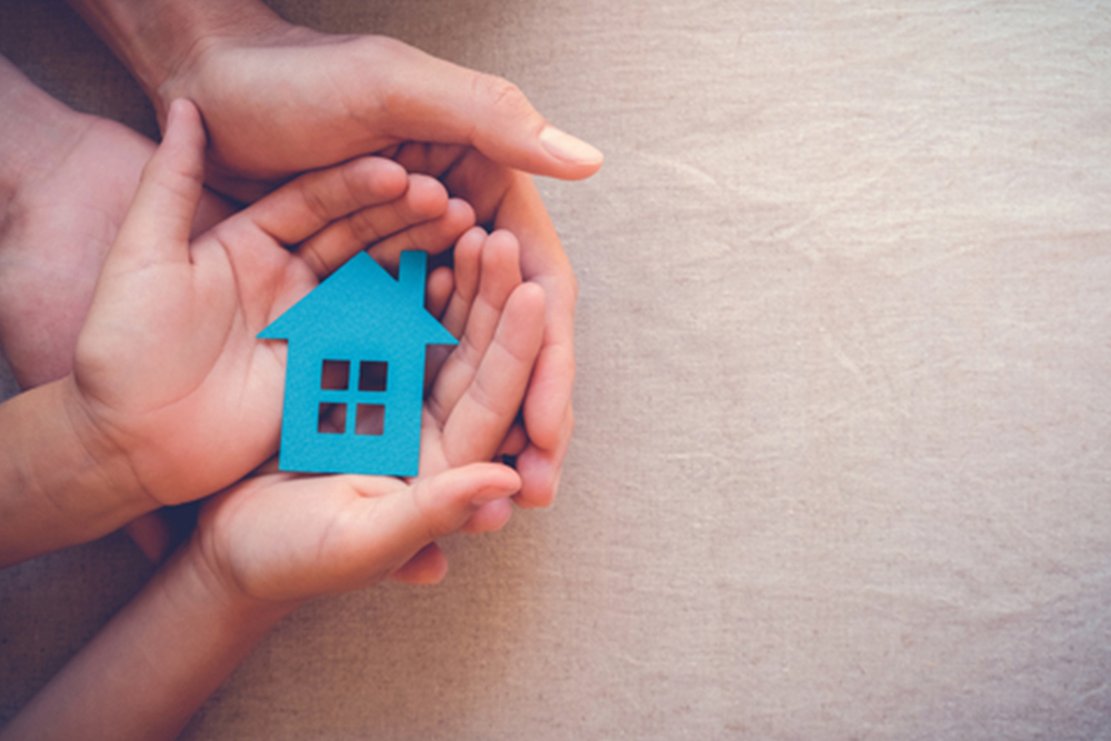 hands holding paper house, family home, homeless housing crisis, economic depression, mortgage concept